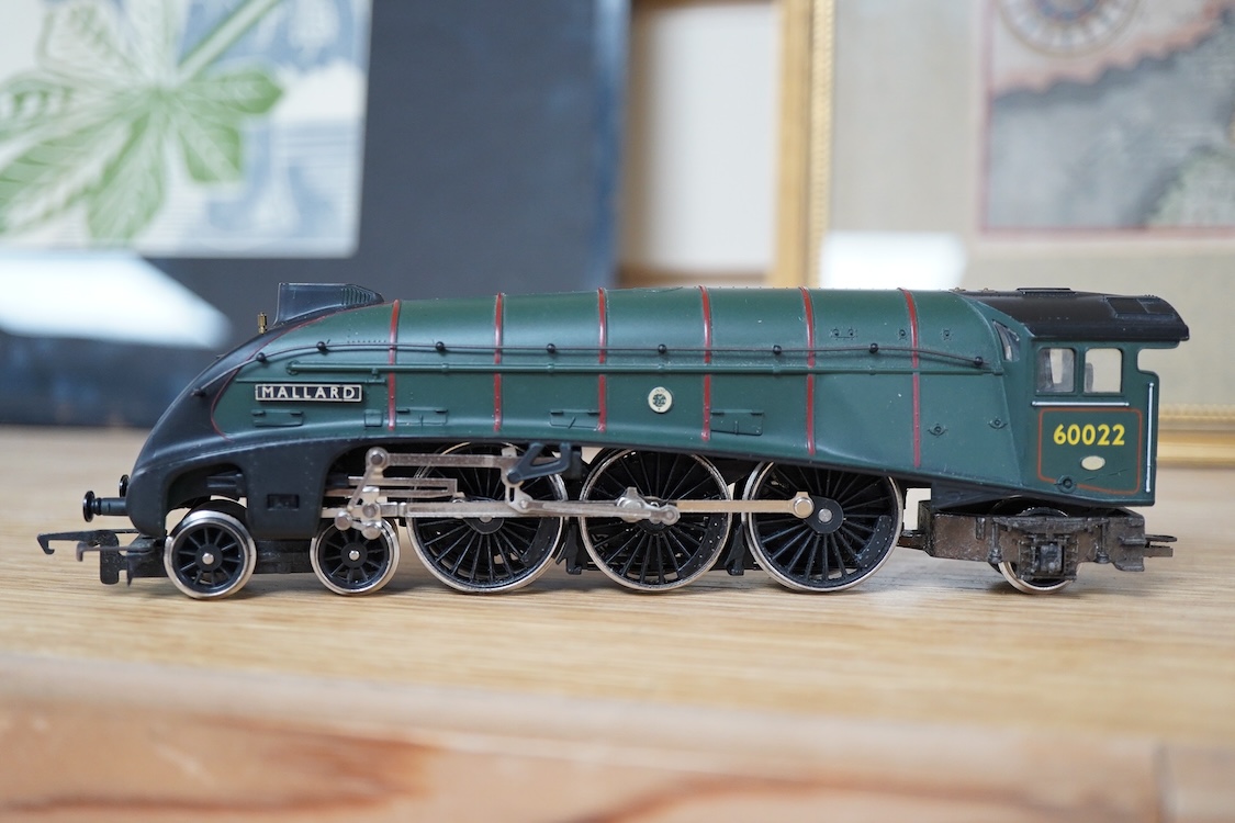 A quantity of 00 gauge model railway by Hornby, Tri-ang, etc. including nineteen locomotives in BR, GWR, LMS, etc. liveries, together with a boxed electrically operated turntable (R070), a terraced house (R8621) and a ga